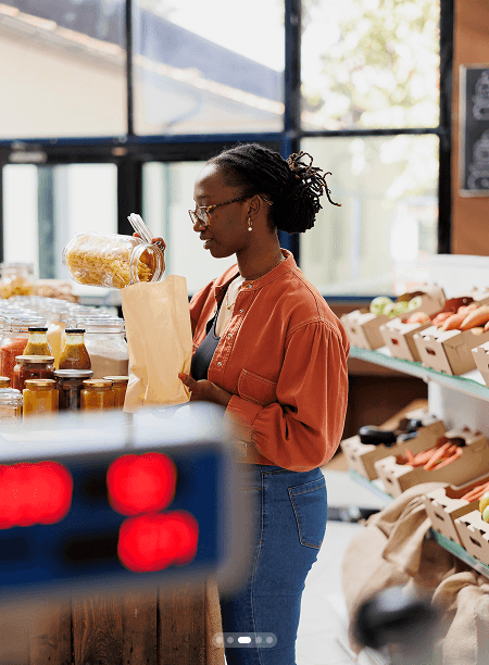 A woman shopping for fresh produce in a market